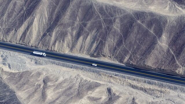 truck-driving-on-road-small
